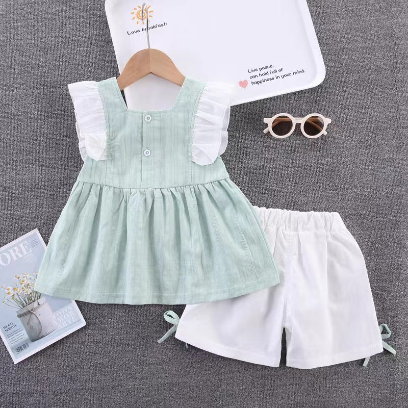 Ruffle dress with white shorts