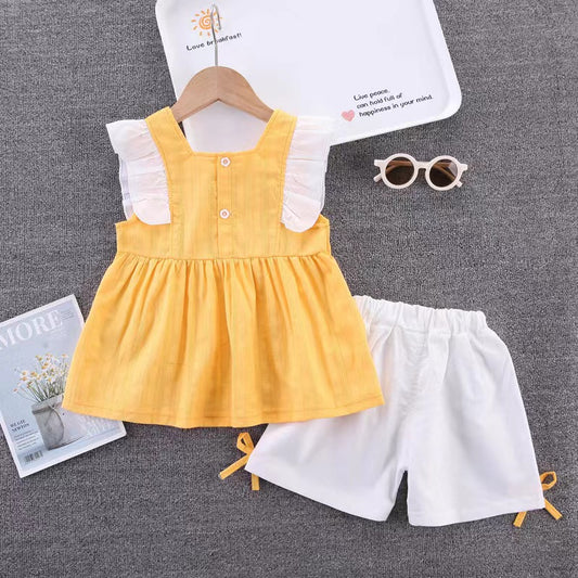 Ruffle dress with white shorts